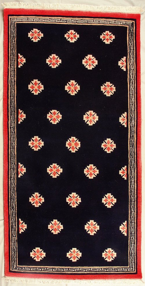 Traditioneller geometrischer Tibet Teppich aus Nepal.